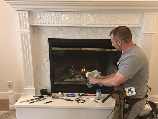 East Hartford Chimney Sweep performing fireplace maintenance in East Hartford, CT