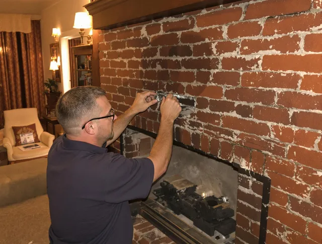 East Hartford Chimney Sweep expert fixing a fireplace in East Hartford, CT